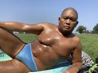 Sunbathing in Bayonne Park_light blue CK thong 4 of 20