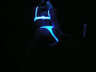 Pulling panties apart under black light