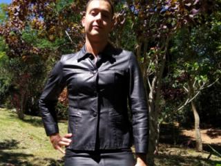 Crossdresser in leather skirt and leather jacket 3 of 4