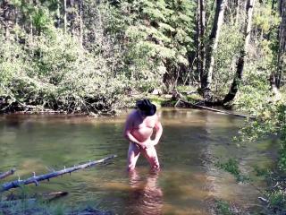 Naked in the creek and cum.