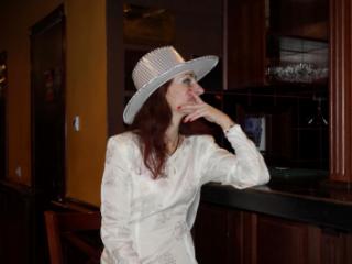 In Wedding Dress and White Hat on stage 5 of 20