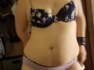 Dancing/facial while cuffed in blue and purple bra and panties 7 of 9