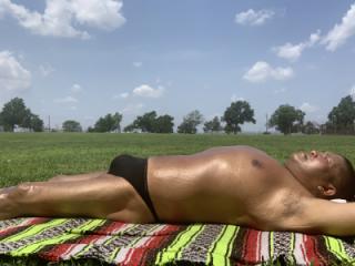 Sunbathing in Bayonne Park in my black CK thong 14 of 20