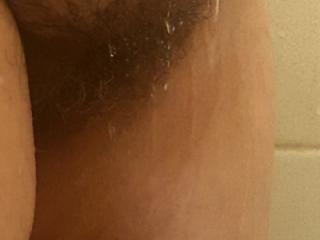 Taking a shower and shaving my legs