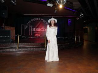 In Wedding Dress and White Hat on stage 14 of 20