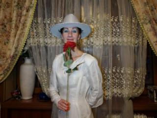 In Wedding Dress and White Hat 13 of 20