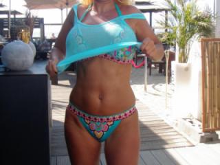 In a new (not so teasing) bikini on a dutch beach 12 of 17