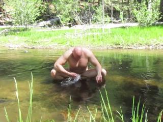 Naked skinny dip in the creek.