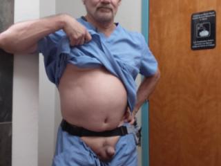 Old guy showing off his little muscle 1 of 4