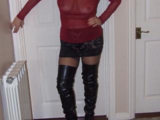 Jane wears red and adds thigh boots 1 of 14