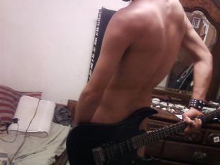 Posing naked with a guitar 5 of 5