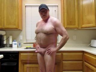 Naked on foot in the kitchen.