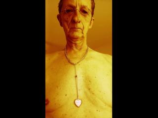 nude wearing chain bracelets and rings