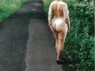 Mature nude walks in English country lane at one with nature 1 of 4