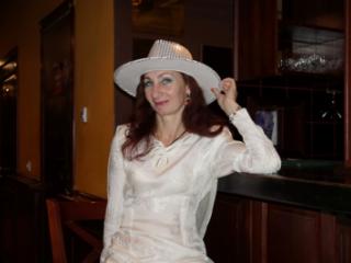 In Wedding Dress and White Hat on stage 8 of 20