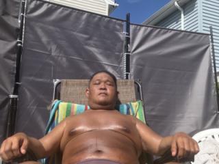 Sunbathing in my backyard in brown thong!!! I bet I STINK! 9 of 19