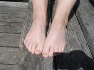 Pretty feet in the sunlight 1 of 7