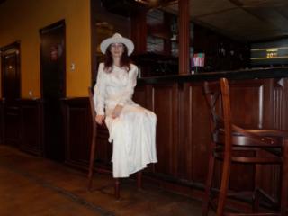 In Wedding Dress and White Hat on stage 1 of 20