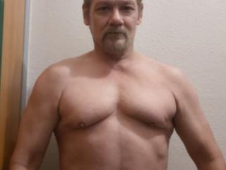 Old guy showing his little muscle 5 of 11