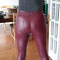 Legs in her maroon tights