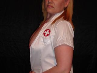 My stunning milf wife, playing the sexy nurse! 7 of 12