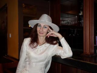 In Wedding Dress and White Hat on stage 9 of 20