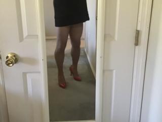 Red heels black skirt
