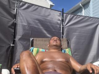 Sunbathing in my backyard in brown thong!!! I bet I STINK! 10 of 19