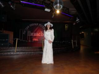 In Wedding Dress and White Hat on stage 16 of 20