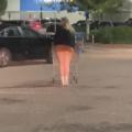 Flashing in parking lot with people a...