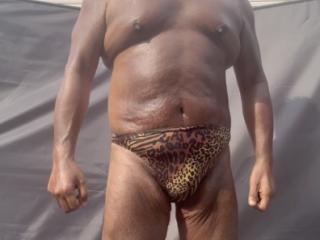 Backyard sunbathing in animal print 7 of 18